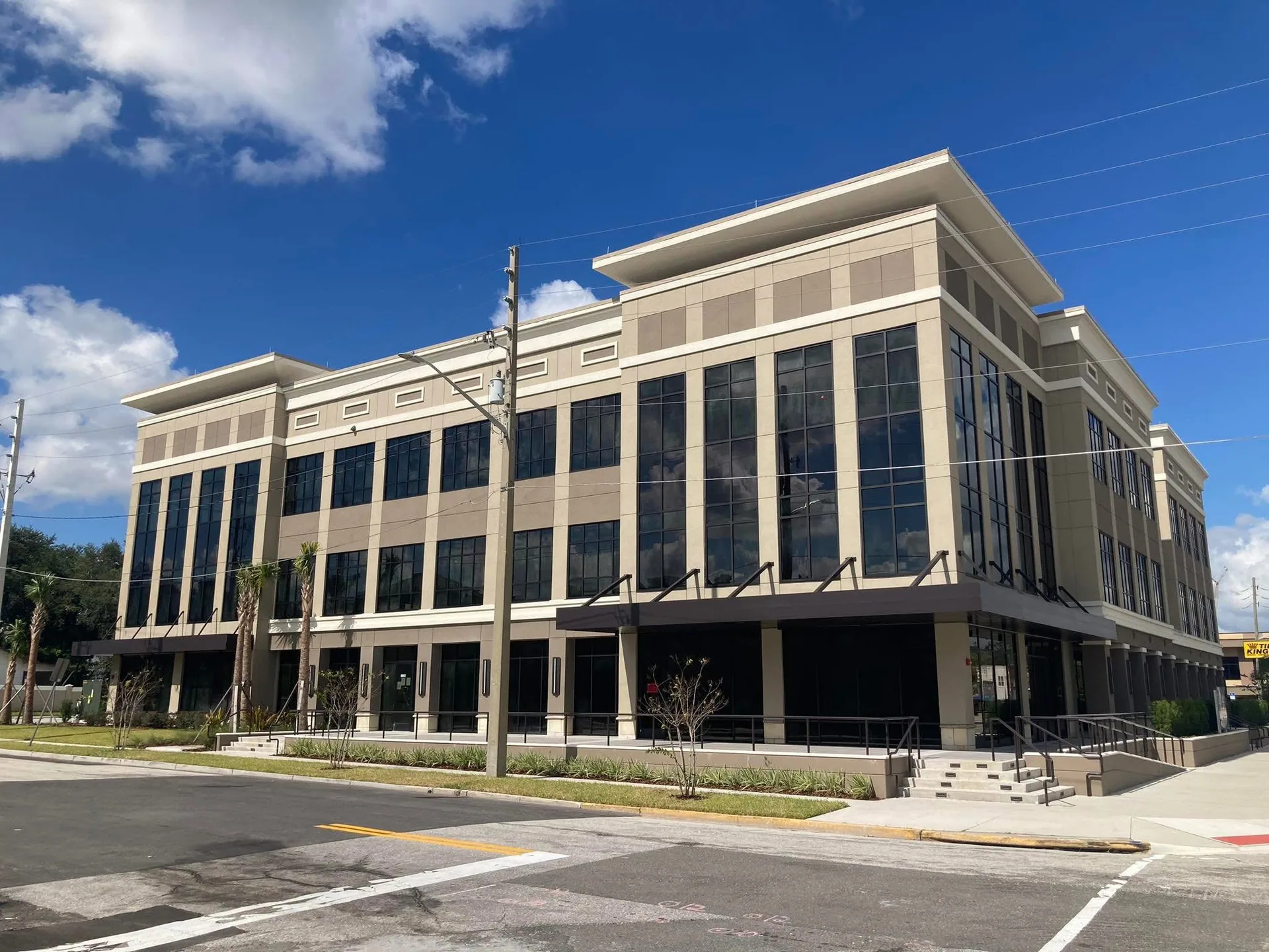 Four-story medical office building with dark glazing, seen from the street.